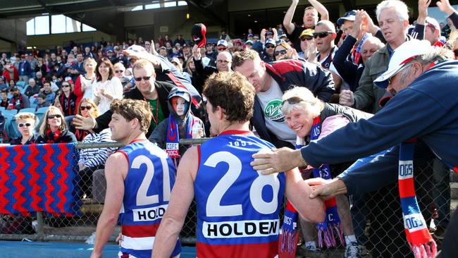 Chris and James Gowans walk off the field, retiring after the semi-final loss to North Adelaide in 2012.