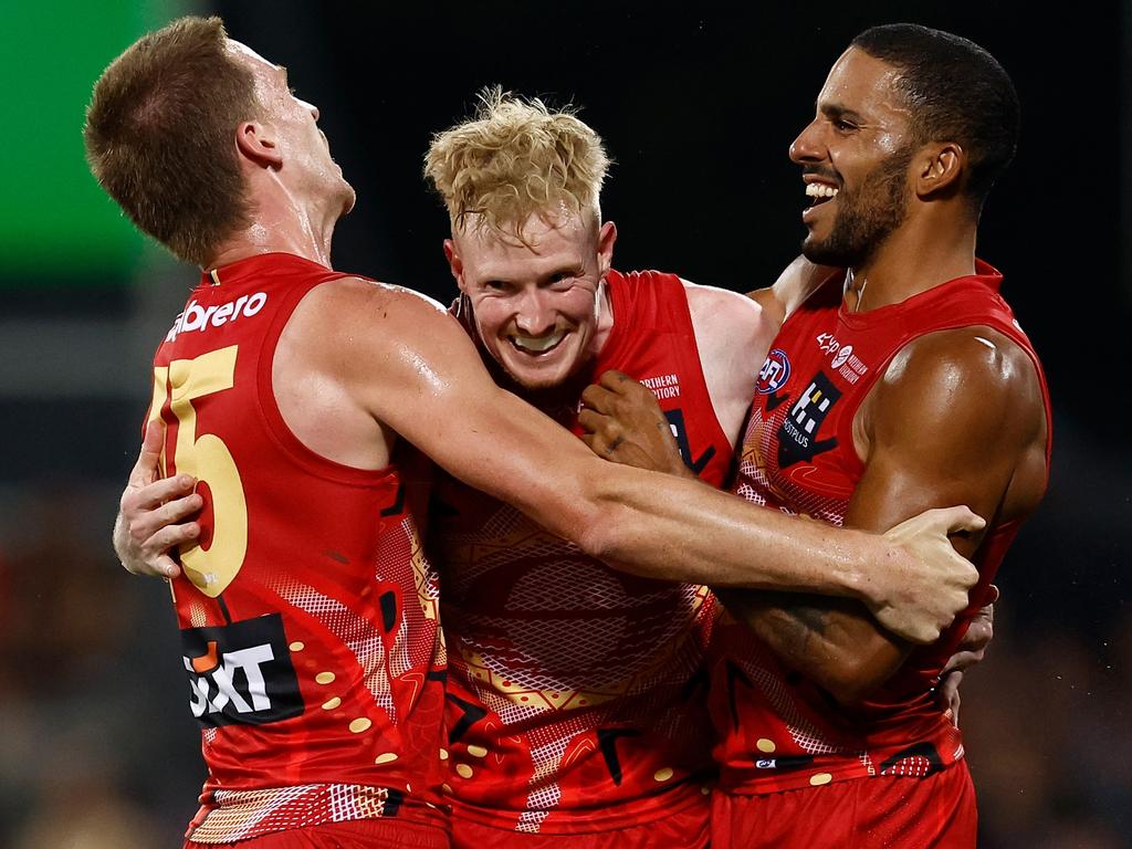 Noah Anderson, John Noble and Touk Miller celebrate Gold Coast’s nailbiting win. Picture: Michael Willson/AFL Photos