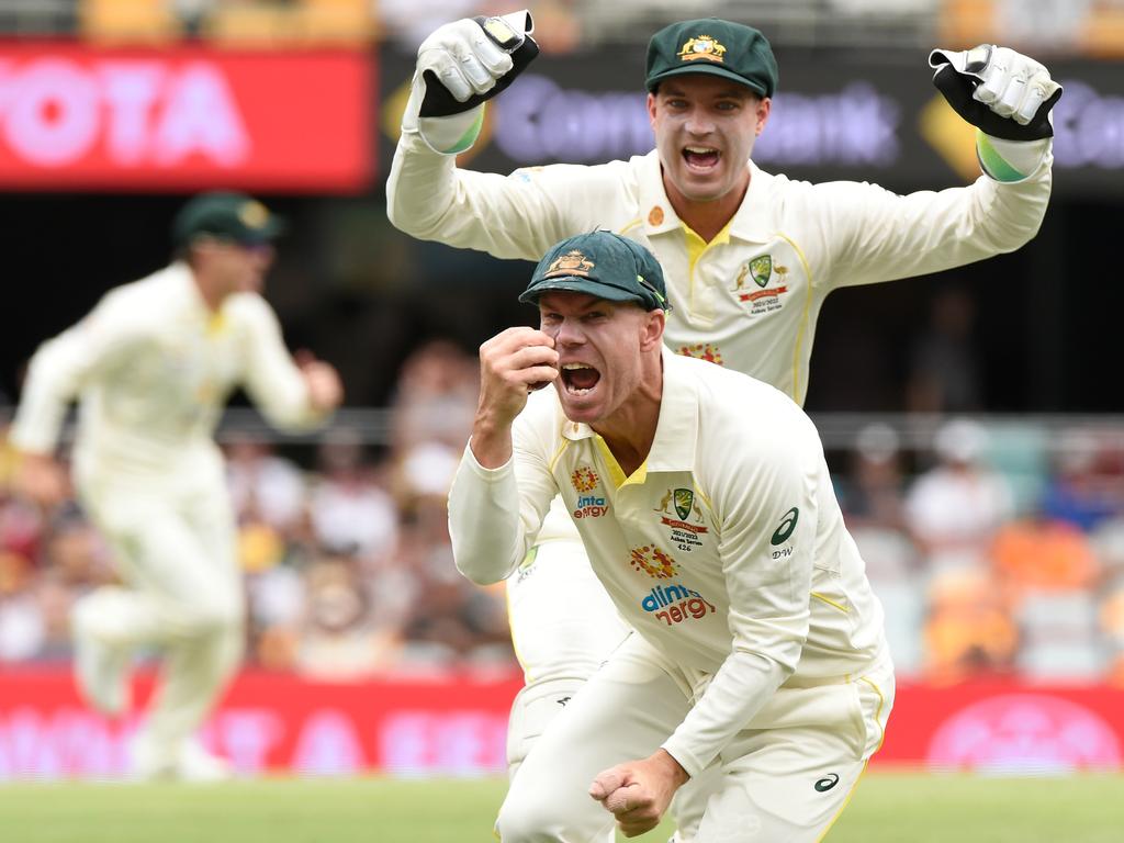 David Warner celebrates after taking a slips catch to dismiss England captain Joe Root for a duck on day one of the first Shes Test. Picture: Matt Roberts – CA/Cricket Australia via Getty Images