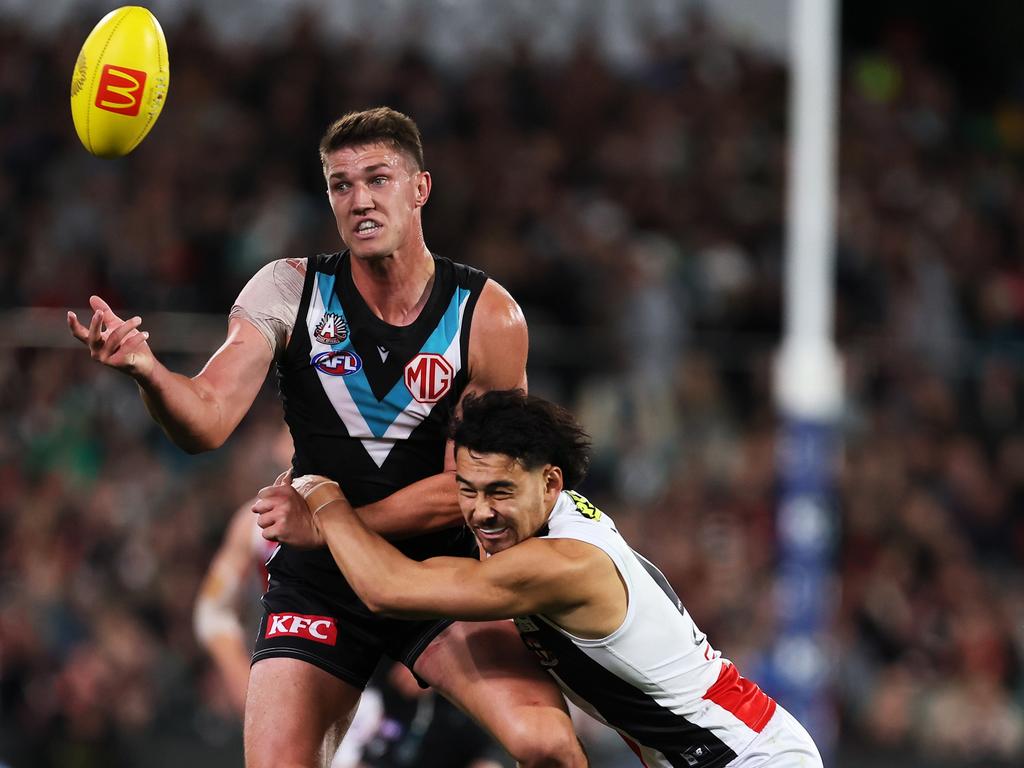 Jordon Sweet of the Power is tackled by Mitch Owens of the Saints during the 2024 AFL Round 07 match. (Photo by James Elsby/AFL Photos via Getty Images)