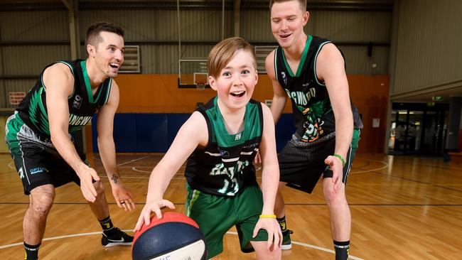 Joey Miller and Jacob Gibson with Brady Cochrane prior to the annual clubfeet fundraising match at Ringwood Picture: Penny Stephens