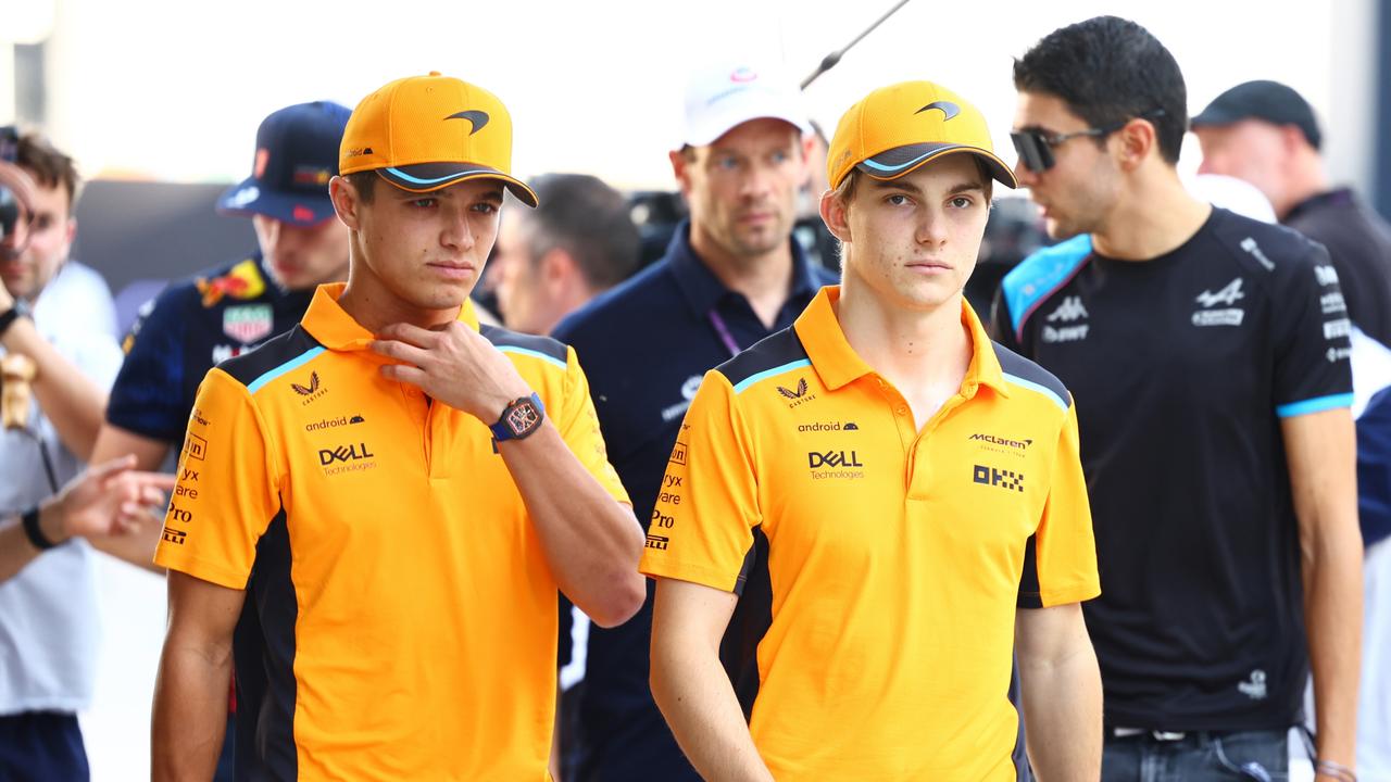 LUSAIL CITY, QATAR - OCTOBER 07: Oscar Piastri of Australia and McLaren and Lando Norris of Great Britain and McLaren walk in the Paddock prior to the Sprint Shootout ahead of the F1 Grand Prix of Qatar at Lusail International Circuit on October 07, 2023 in Lusail City, Qatar. (Photo by Mark Thompson/Getty Images)