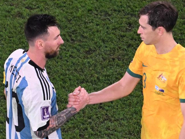 Socceroo Craig Goodwin (right) shakes hands with Argentina's Lionel Messi after Australia's 2-1 loss. Picture: Kirill Kudryavtsev/AFP