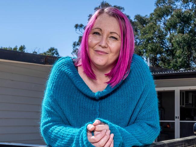 Tina Bull at her Monbulk house, which she's keen to list as soon as restrictions ease so she can move to Queensland. Melburnians will move to regional Victoria or interstate as a consequence of extended lockdown. Picture: Jake Nowakowski