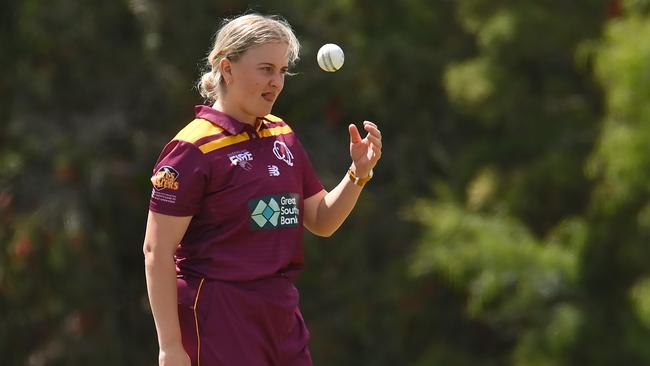 Grace Parsons of Queensland tosses the ball before bowling during the WNCL match between Queensland and the Australian Capital Territory at Bill Pippen Oval, on October 03, 2022, in Gold Coast, Australia. Picture: Albert Perez/Getty Images