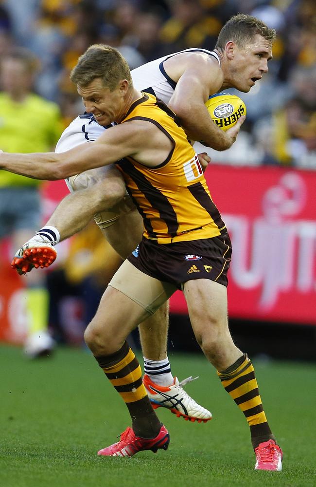 Joel Selwood and Sam Mitchell go head-to-head. Picture: Michael Klein