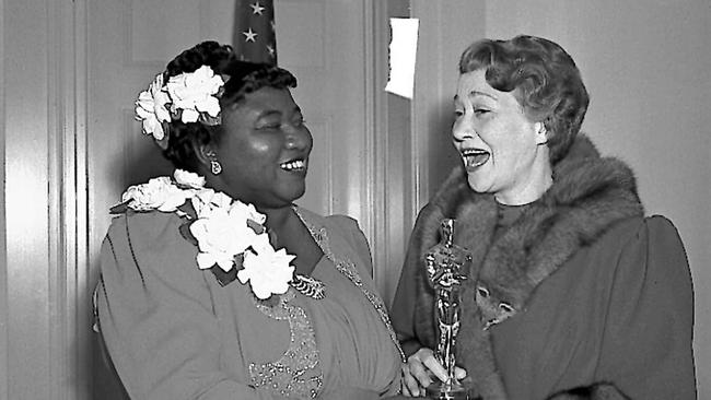 Actress Hattie McDaniel is presented with her Oscar by actress Fay Bainter. Picture: AP