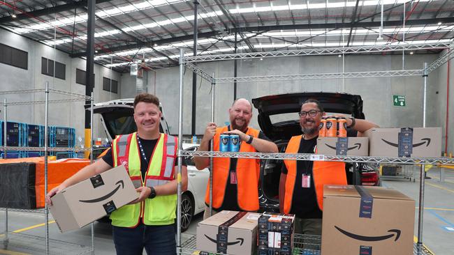 Amazon’s logistics country lead Tim Coventry with Six Strings Brewery general manager Brent Adams and owner Chris Benson. Picture: Sue Graham