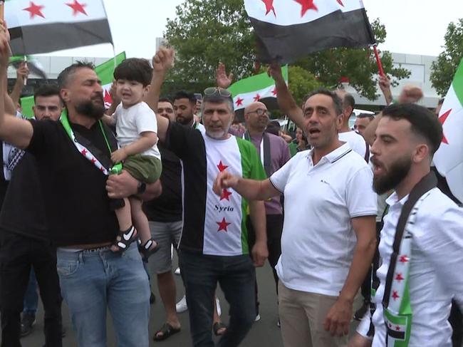 Scenes of jubilation in Chullora this afternoon after Syrian Rebels force regime change in Syria. Picture: TNV