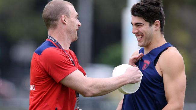 Simon Goodwin shares a laugh with Christian Petracca. Picture: Wayne Ludbey