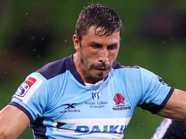 Jake Gordon of the Waratahs kicks the ball during the Round 3 Super Rugby match between the Melbourne Rebels and NSW Waratahs at AAMI Park in Melbourne, Friday, February 14, 2020. (AAP Image/Scott Barbour) NO ARCHIVING, EDITORIAL USE ONLY