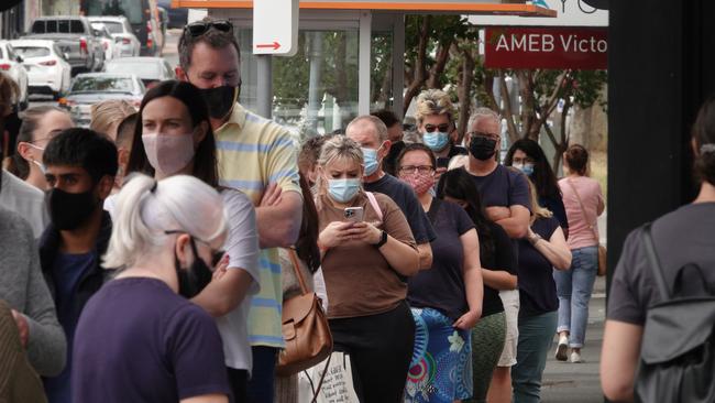 A large queue of people outside a Hawthorn East pharmacy lining up for rapid antigen tests. Picture: Alex Coppel