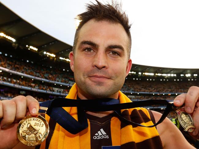 Embargoed until midnight Nov 13th.  Brian Lake of the Hawks poses for a photograph with his Norm Smith Medal and Premiership medal during the 2013 Toyota Grand Final match between the Hawthorn Hawks and the Fremantle Dockers at the MCG, Melbourne on September 28, 2013. (Photo: Michael Willson/AFL Media)