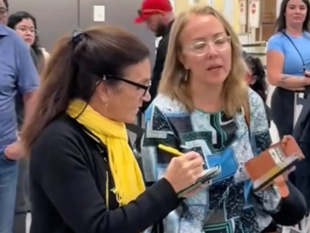 A Spirit employee orders a passenger to show her boarding pass after a confrontation that led the staffer to yell, ‘F**k you, too’. Picture: TikTok/sightssoundsflavors