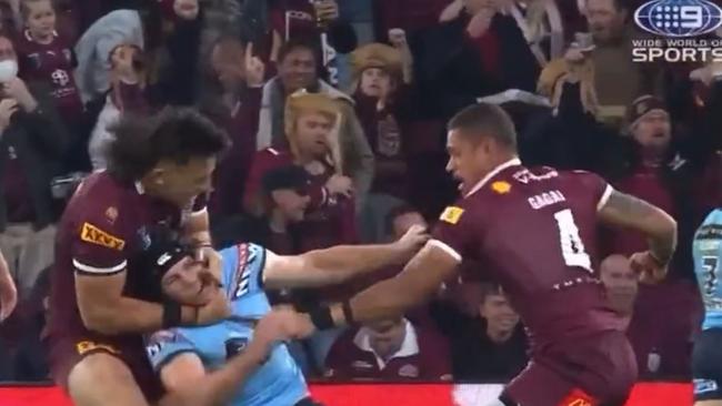 The Titans say skipper Tino Fa’asuamaleaui was trying to defuse the situation when he put Matt Burton in a headlock. Source: Channel 9