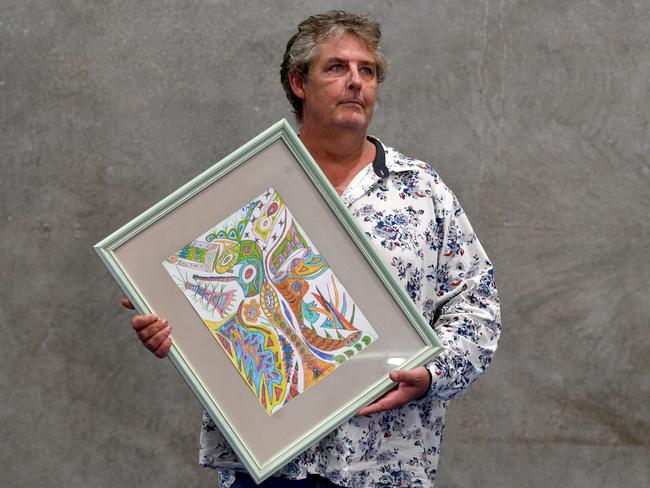 Artist Shane Dale with one of his artworks. Picture: Evan Morgan