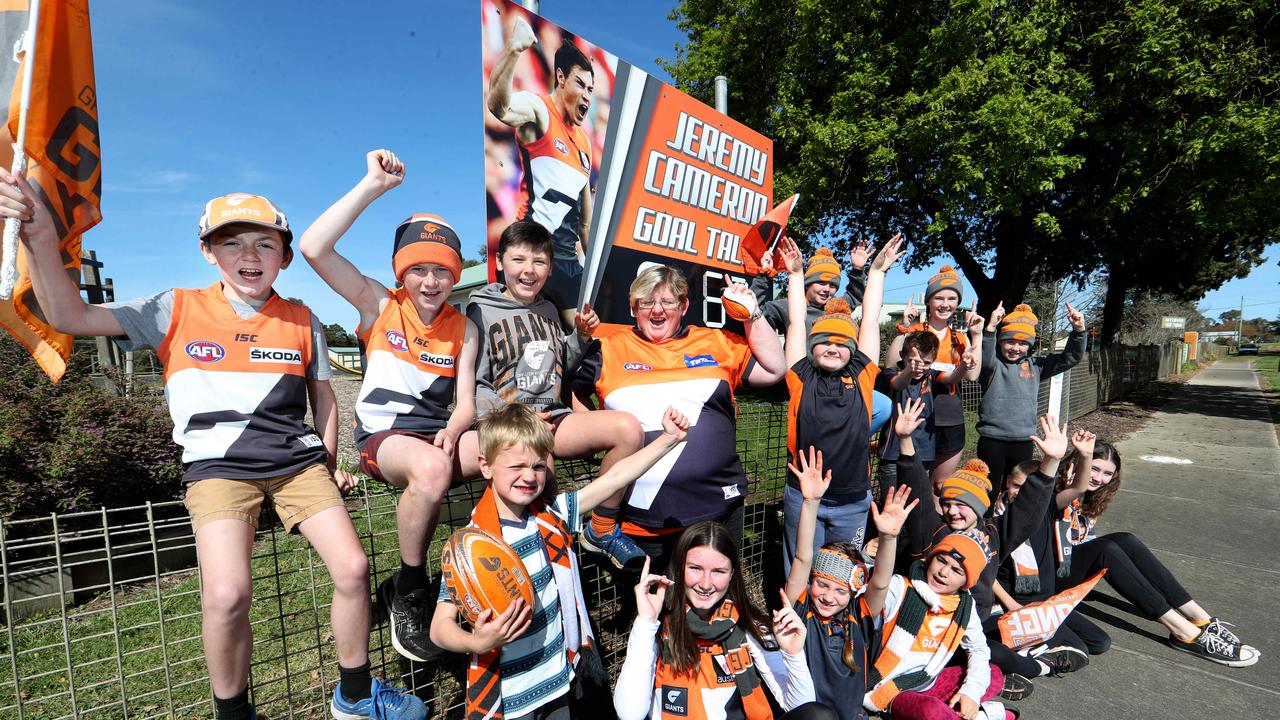 School students from Dartmoor primary School with principal Rose Wombwell wearing the GWS colours in support of local hero GWS star Jeremy Cameron who is a former student. Picture: David Geraghty, The Australian.