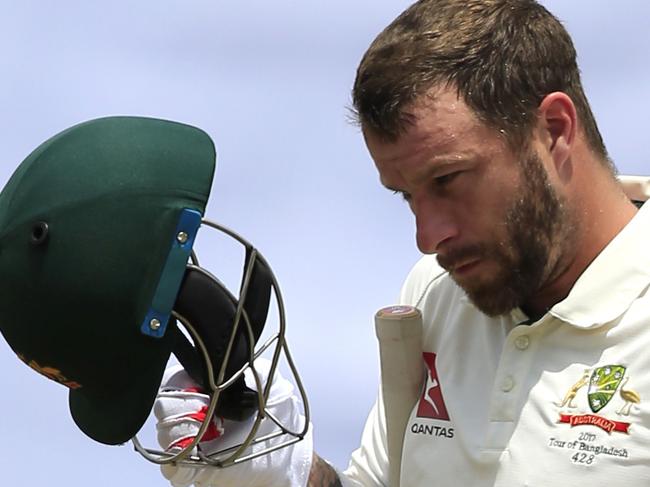 Australia's wicketkeeper Matthew Wade walks back to the pavilion after his dismissal by Bangladesh's Sakib Al Hasan during the fourth day of their first test cricket match in Dhaka, Bangladesh, Wednesday, Aug. 30, 2017. (AP Photo/A.M. Ahad)
