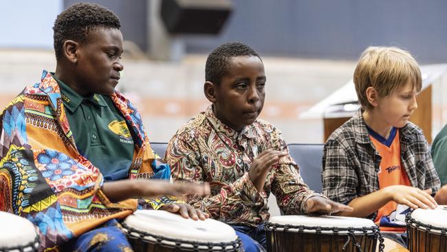 African drumming showcase participants (from left) Joshua Mukeba, Peter Faustine and Cooper Mayers during Harmony Day celebrations at Darling Heights State School. Picture: Kevin Farmer