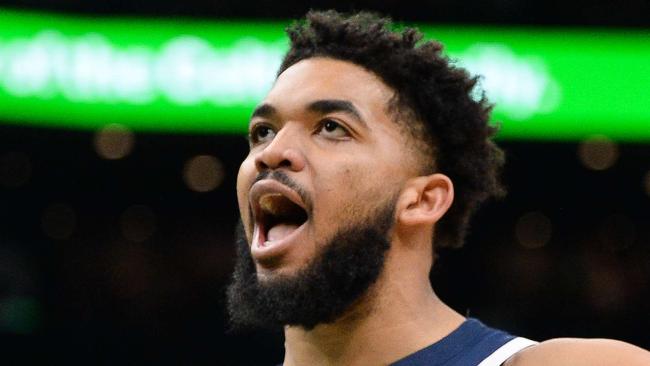 BOSTON, MA- MARCH 27: Karl-Anthony Towns #32 of the Minnesota Timberwolves reacts after dunking the ball against the Boston Celtics in the first half at TD Garden on March 27, 2022 in Boston, Massachusetts. NOTE TO USER: User expressly acknowledges and agrees that, by downloading and or using this photograph, User is consenting to the terms and conditions of the Getty Images License Agreement.   Kathryn Riley/ Getty Images/AFP == FOR NEWSPAPERS, INTERNET, TELCOS & TELEVISION USE ONLY ==