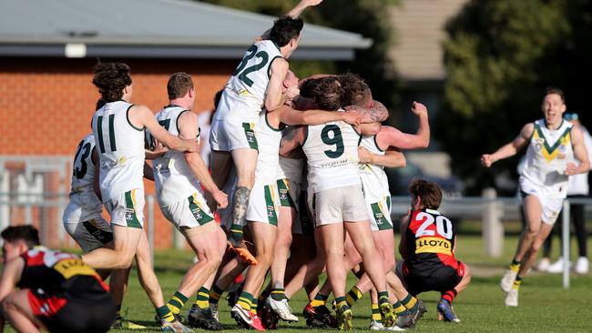 GFL preliminary finals Senior footy: Newtown &amp; Chilwell v Leopold. Leopold's Connor Giddings (no 18) kicks the winning goal after he siren and celebrates with the team. Picture: Mike Dugdale