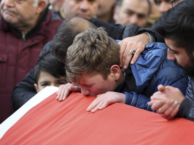 Family members and friends mourn as they attend funeral prayers for Ayhan Akin, one of the nightclub victims. Picture: AP