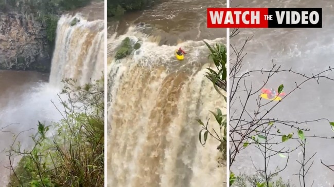 Moment 'mad man' kayaks off waterfall