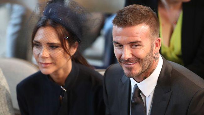 David and Victoria Beckham take their seats in St George's Chapel before the wedding ceremony of Britain's Prince Harry, Duke of Sussex and US actress Meghan Markle in St George's Chapel, Windsor Castle, in Windsor, on May 19, 2018. / AFP PHOTO / POOL / Danny Lawson