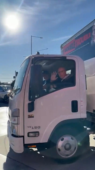 Albanese, Dutton out and about early on election day