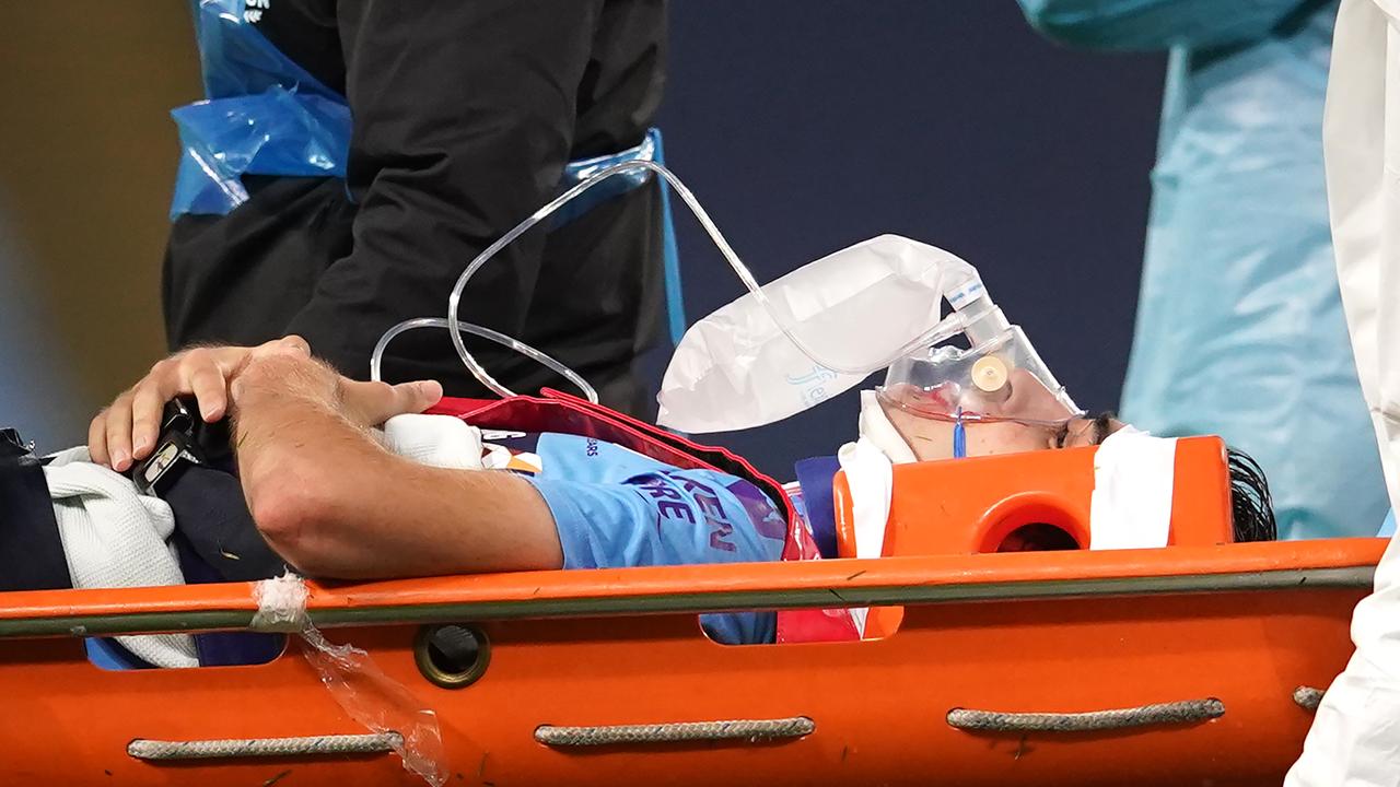 Eric Garcia is stretchered off after receiving medical treatment.