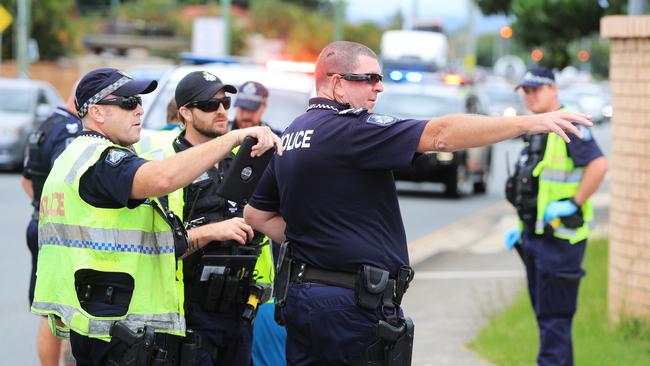 Police at the scene. Photo: Scott Powick.