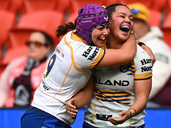 BRISBANE, AUSTRALIA - JULY 27: Kennedy Cherrington of the Eels celebrates with Rueben Cherrington after scoring a try during the round one NRLW match between Brisbane Broncos and Parramatta Eels at Suncorp Stadium on July 27, 2024 in Brisbane, Australia. (Photo by Albert Perez/Getty Images)