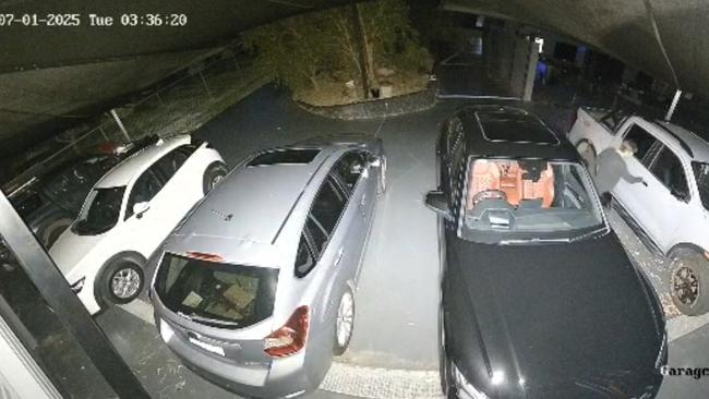 Stills from video footage showing at man attempting to steal cars from the Gold Coast property of Village Roadshow COO Bikash Randhawa. Picture: Supplied