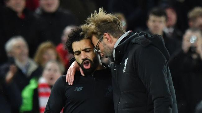 Liverpool's German manager Jurgen Klopp (R) gestures with Liverpool's Egyptian midfielder Mohamed Salah