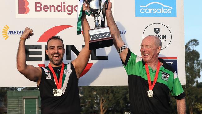 Donvale’s James Rausa and coach Kevin Collins lift the 2023 Division 3 cup. Picture: Davis Harrigan