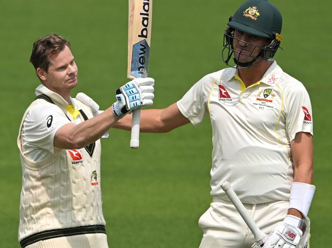 Cummins congratulates Smith on his century at Lord’s. Picture: Stu Forster/Getty Images