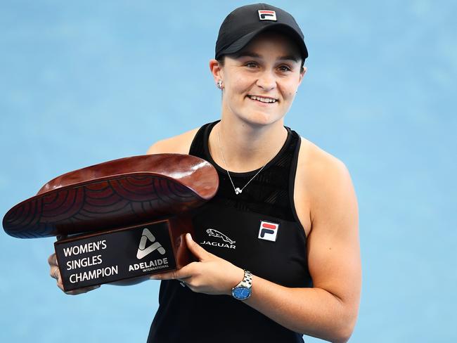 ADELAIDE, AUSTRALIA - JANUARY 09: Ashleigh Barty of Australia  holds the Womens Singles Champion trophy after defeating Elena Rybakina of Kazakhstan during day eight of the 2022 Adelaide International at Memorial Drive on January 09, 2022 in Adelaide, Australia. (Photo by Mark Brake/Getty Images)