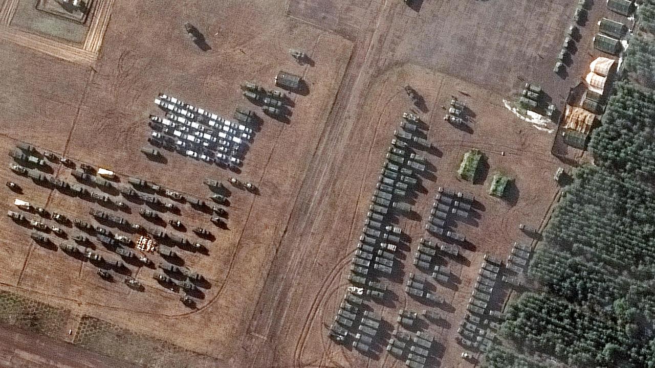 A satellite image shows assembled vehicles, part of a new deployment consisting of more than 100 vehicles and dozens of troop tents/shelters, at a small airfield known as the VD Bolshoy Bokov aerodrome near Mozyr, southern Belarus, north of the border with Ukraine. Picture: Maxar Technologies/AFP