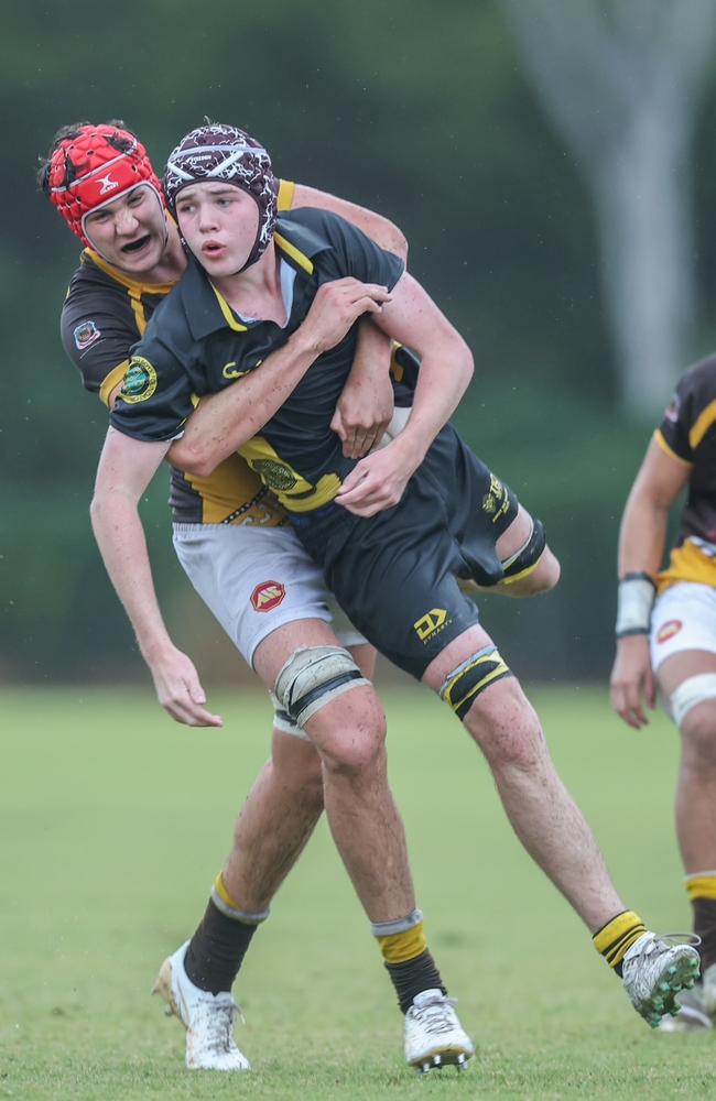 Will Ross brings a St Laurence’s player to ground.