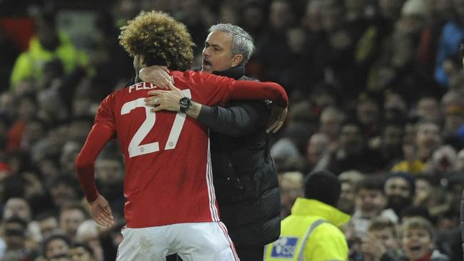 Manchester United's manager Jose Mourinho celebrates with Marouane Fellaini after he scored.