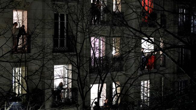 Parisians applaud healthcare employees from their balconies in Paris. Picture: AFP