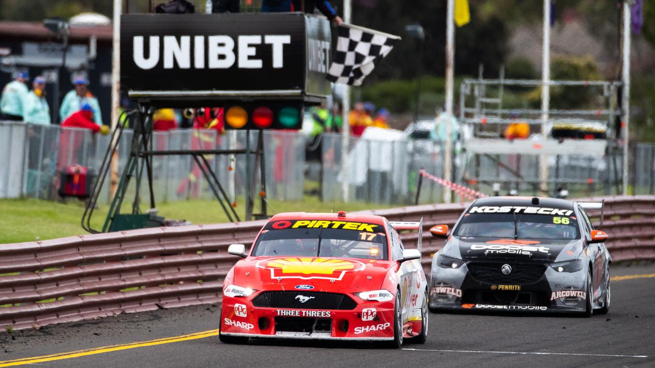 Scott McLaughlin takes the chequered flag to clinch the title. Picture: Daniel Kalisz