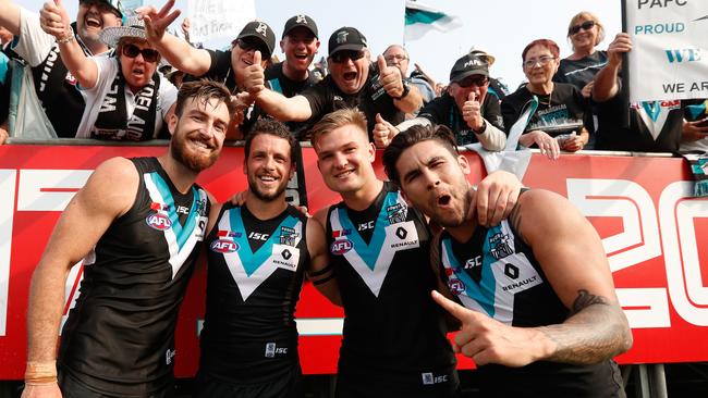 Charlie Dixon, Travis Boak, Ollie Wines and Chad Wingard of the Power celebrate their win against Gold Coast Suns at Jiangwan Sports Stadium in Shanghai, China in May. Picture: Michael Willson/AFL Media/Getty Images