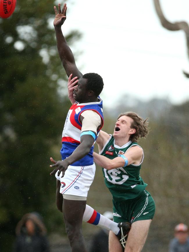 Majak Daw wins the hitout over Tom Brindley. Picture: Hamish Blair