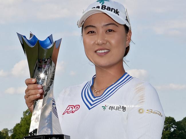 CINCINNATI, OHIO - SEPTEMBER 10: (EDITOR'S NOTE: This image was sent with alternate crop). Minjee Lee of Australia celebrates with the trophy after winning in a two-hole playoff against Charley Hull (not pictured) of England during the final round of the Kroger Queen City Championship presented by P&G at Kenwood Country Club on September 10, 2023 in Cincinnati, Ohio.   Dylan Buell/Getty Images/AFP (Photo by Dylan Buell / GETTY IMAGES NORTH AMERICA / Getty Images via AFP)