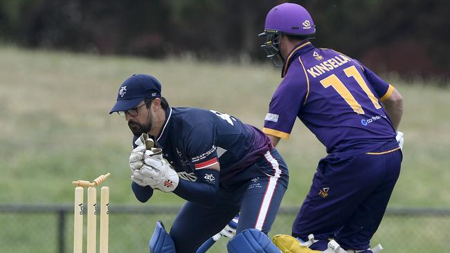 Luke Reid removes the bails as David Kinsella passes the crease. Picture: Andy Brownbill