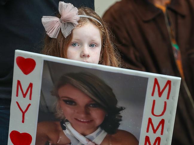 MELBOURNE, AUSTRALIA.NewsWire Photos.JULY 27, 2024.The daughter of murder victim Katie Haley holds a picture of her mother during the No More Rally into violence against women. Picture: NewsWire/Ian Currie, , *Photographer got permission from family for the daughters face/photo to be used but NOT the child's name**