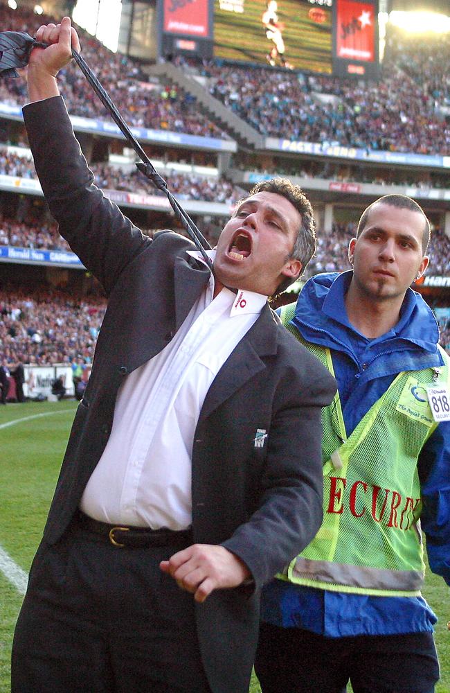 2004: Port Adelaide coach Mark Williams mocks his detractors who called his side chokers after the Power’s 40-point victory gave the club its first AFL premiership and denied the Brisbane Lions their forth on the trot. Picture: Fiona Hamilton