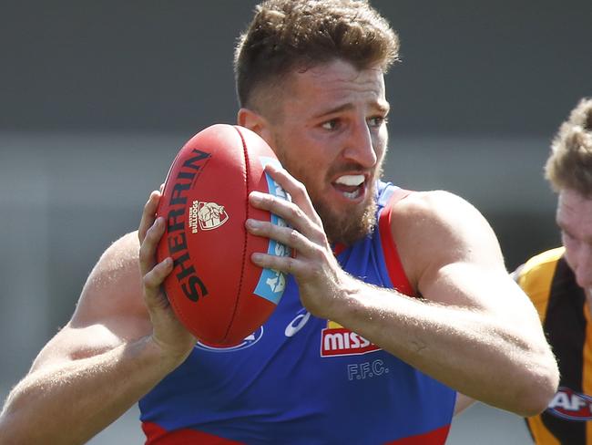 MELBOURNE, AUSTRALIA - FEBRUARY 24: Marcus Bontempelli of the Bulldogs is tackled by Ben McEvoy of the Hawks during the AFL Practice Match between the Western Bulldogs and the Hawthorn Hawks at Whitten Oval on February 24, 2021 in Melbourne, Australia. (Photo by Daniel Pockett/AFL Photos/via Getty Images)