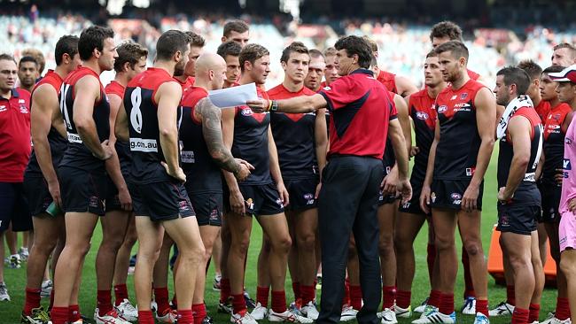 Paul Roos addresses the Demons at three quarter time. Picture Wayne Ludbey. 